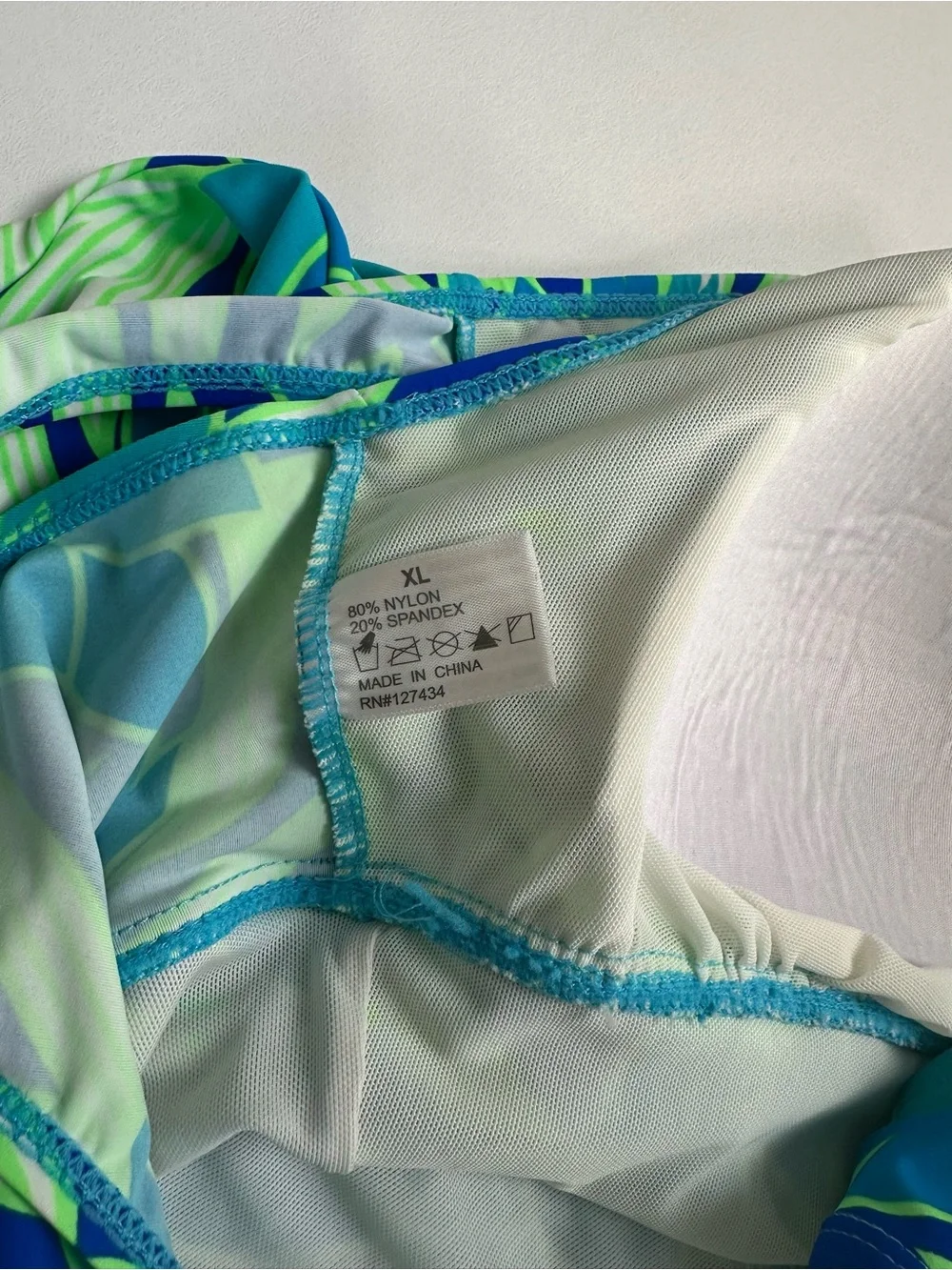 Swim outlet women’s XL  one piece swim dress .‎ Blue green, tropical print.